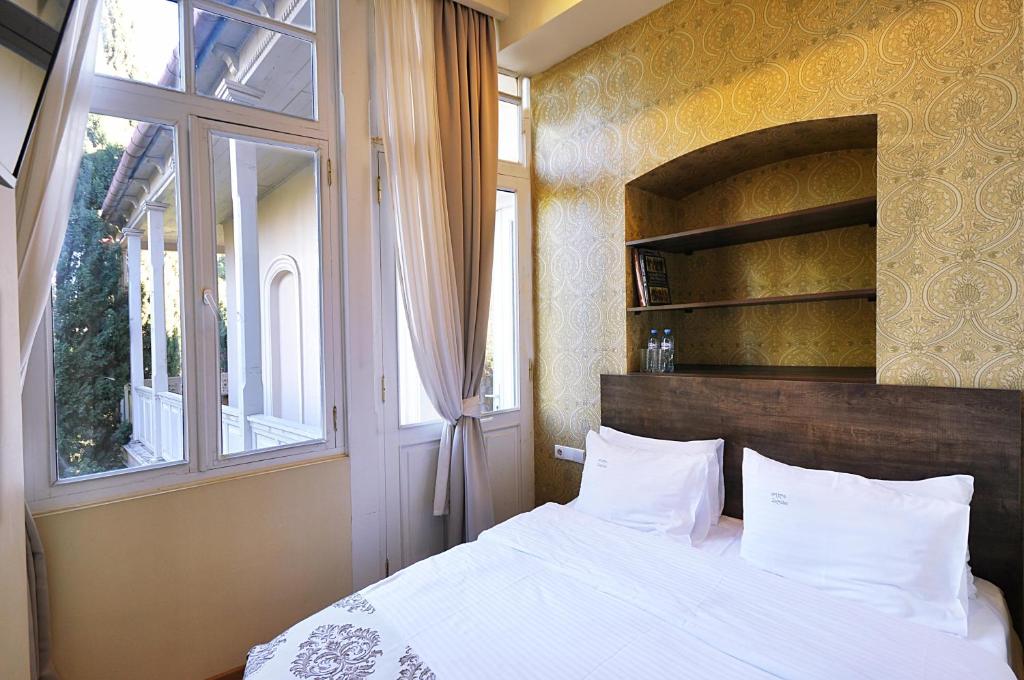 Postel nebo postele na pokoji v ubytování Tekla Palace By Urban Hotels