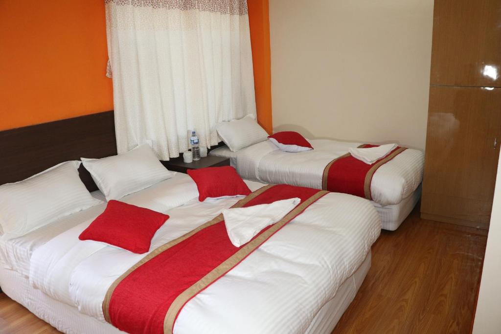 Postel nebo postele na pokoji v ubytování Rambler Hostel Pvt Ltd