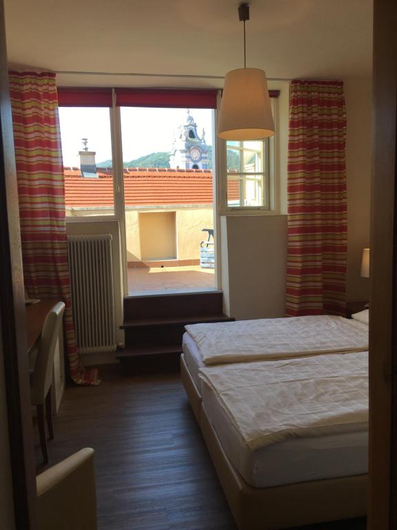 Postel nebo postele na pokoji v ubytování Pension Altes Rathaus