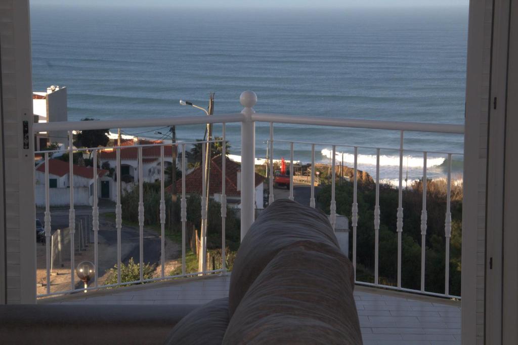 a view of the ocean from a balcony at Ericeira Sunset Apartment in Ericeira