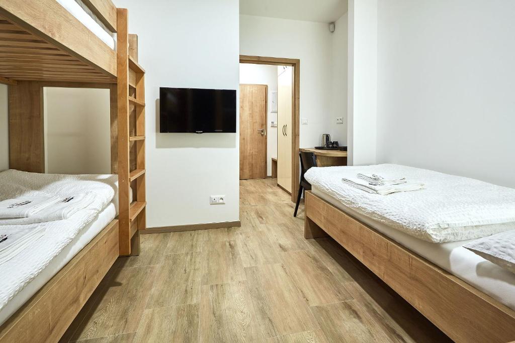 Postel nebo postele na pokoji v ubytování Penzion U Zámku