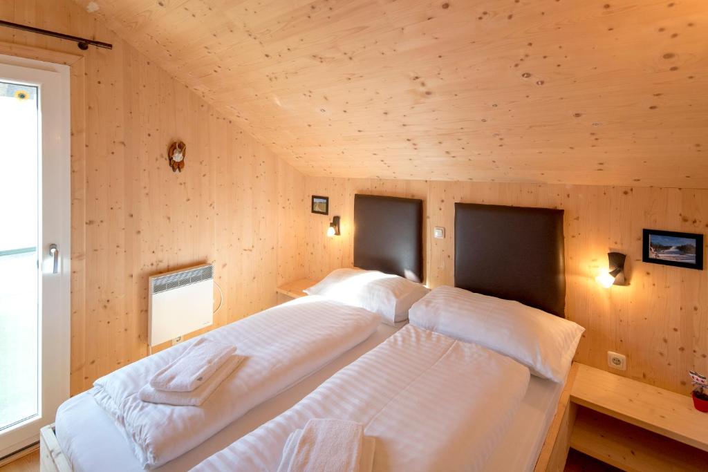 Postel nebo postele na pokoji v ubytování Luxury Chalet Kreischberg 11a