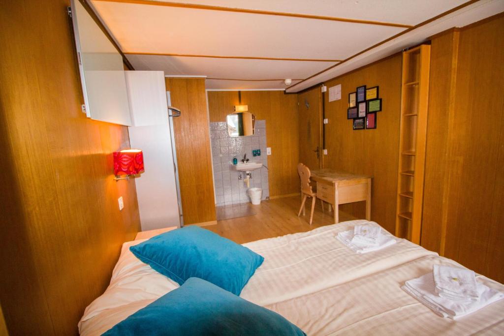 Postel nebo postele na pokoji v ubytování Hotel Hornerpub