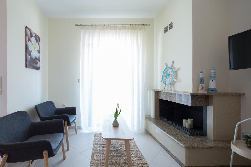 Televízia a/alebo spoločenská miestnosť v ubytovaní KHouses Maissonette