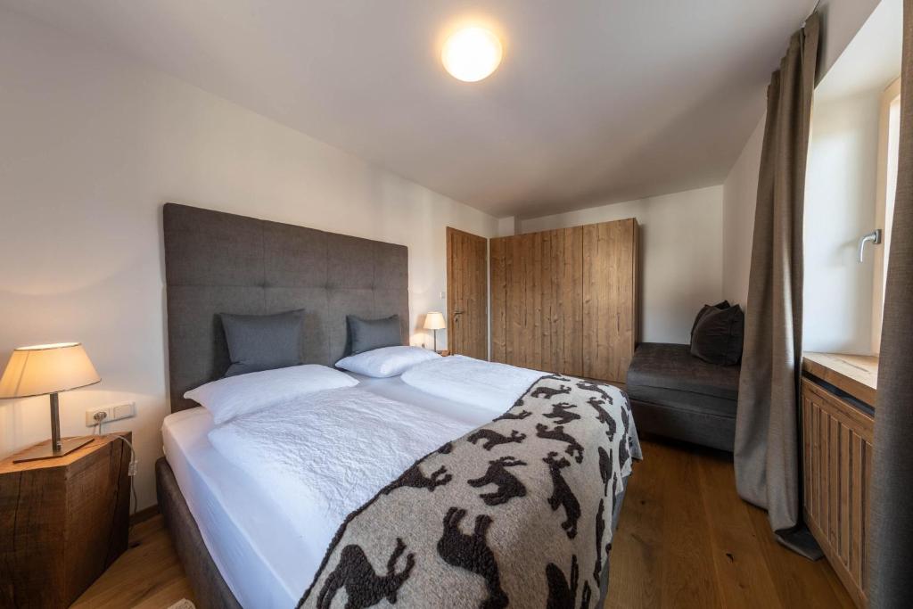 Postel nebo postele na pokoji v ubytování hubertus dolomites