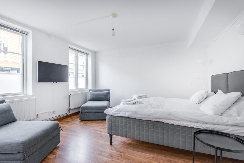 Säng eller sängar i ett rum på City Apartments in Jonkoping
