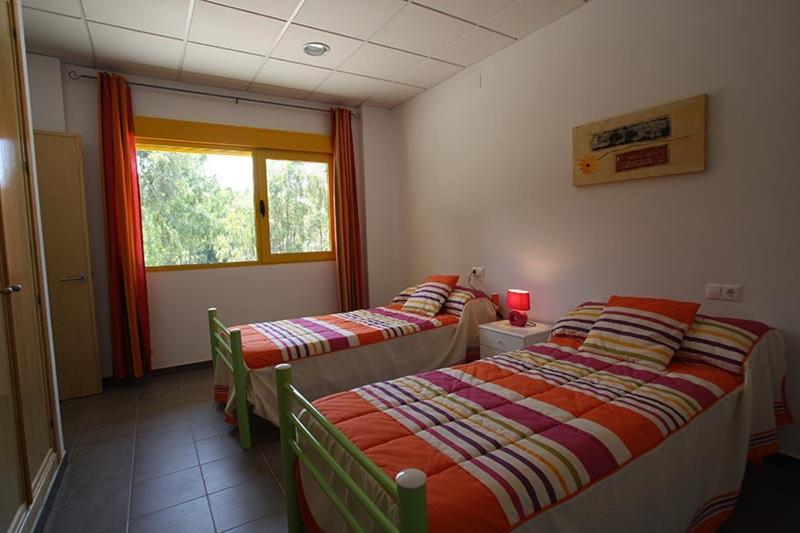Postel nebo postele na pokoji v ubytování Apartamentos Villa Vacacional