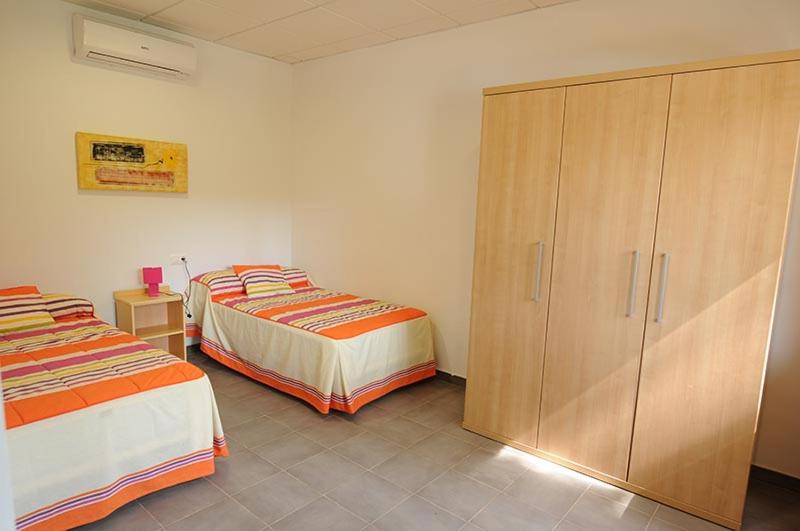 Postel nebo postele na pokoji v ubytování Apartamentos Villa Vacacional
