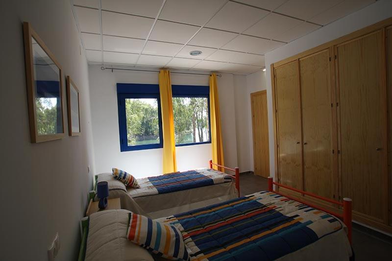 Postel nebo postele na pokoji v ubytování Apartamentos Villa Vacacional
