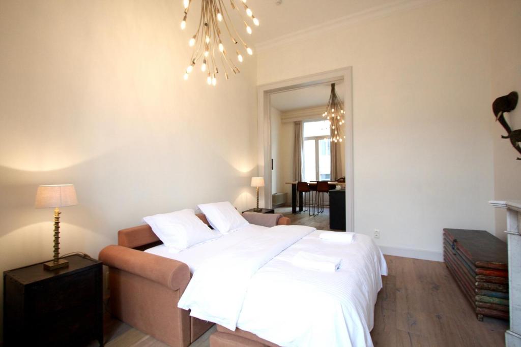 Een bed of bedden in een kamer bij Cap's House