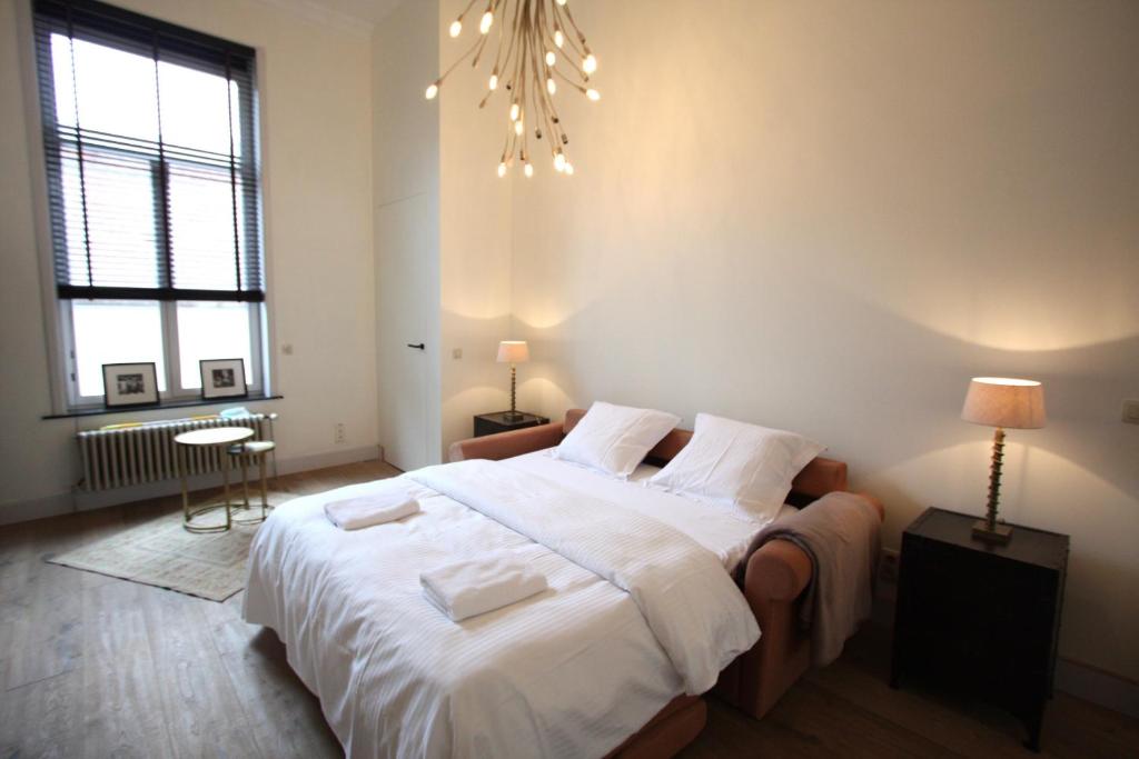 Een bed of bedden in een kamer bij Cap's House