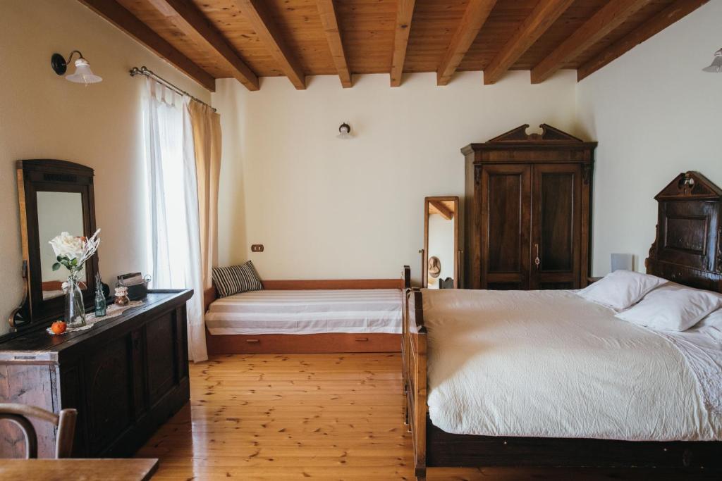 Postel nebo postele na pokoji v ubytování B&B Pedelmont
