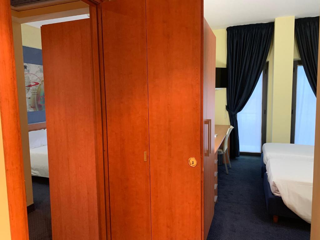 Postel nebo postele na pokoji v ubytování Best Western Hotel Class Lamezia