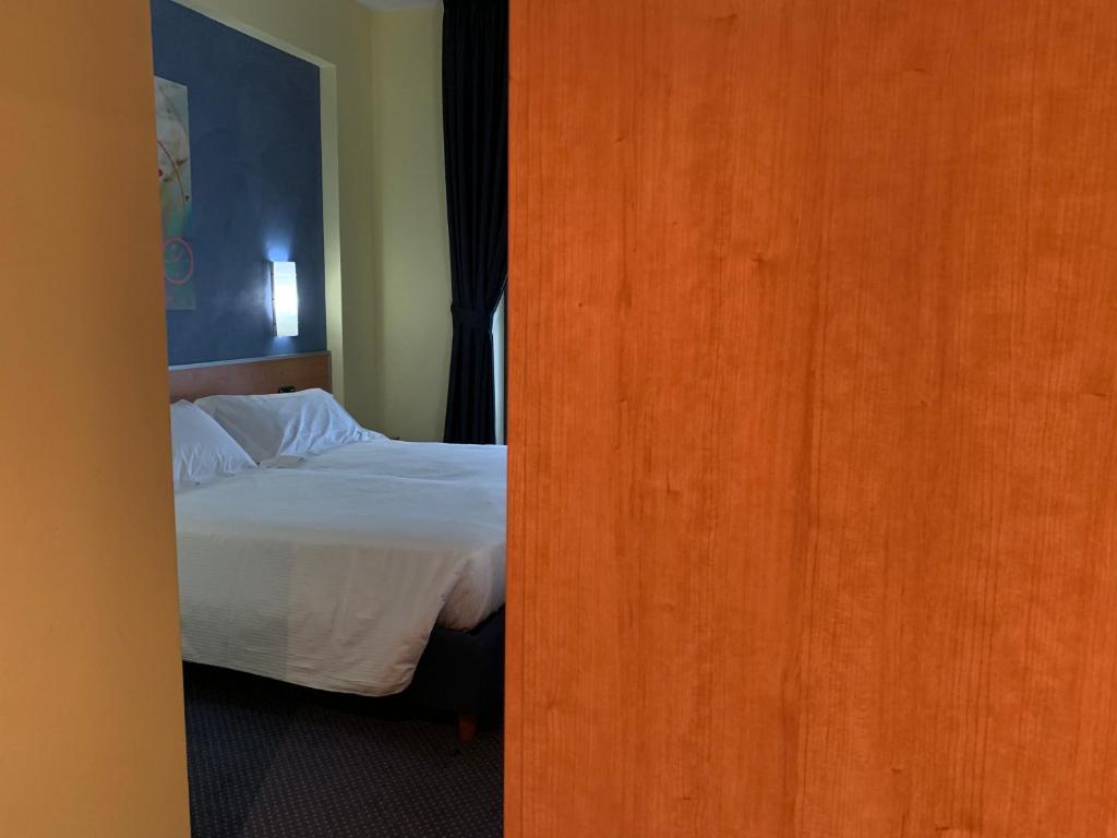 Postel nebo postele na pokoji v ubytování Best Western Hotel Class Lamezia