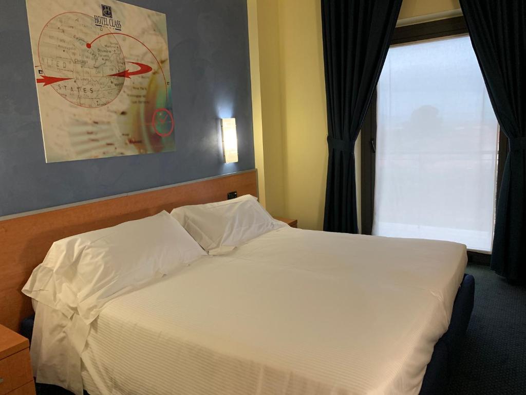 Postel nebo postele na pokoji v ubytování Best Western Hotel Class Lamezia