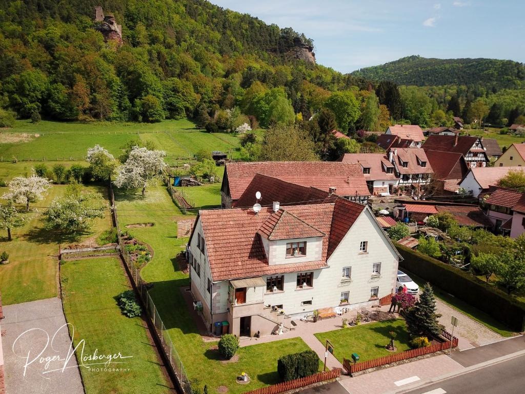 an aerial view of a house in a village at Chambre d'Hotes Petit Arnsbourg in Obersteinbach