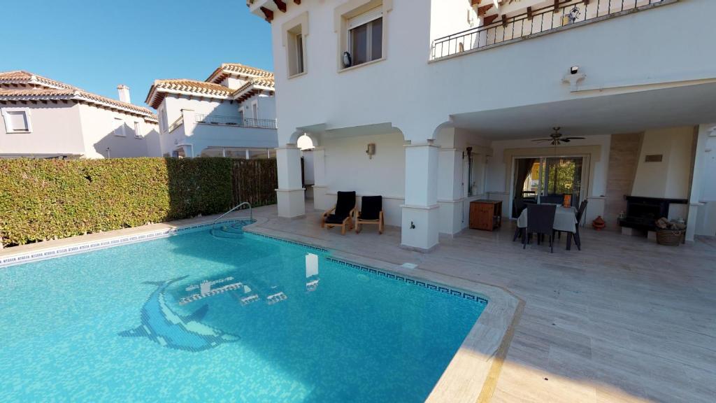 een zwembad voor een huis bij Villa Pino Tea - A Murcia Holiday Rentals Property in Los Alcázares