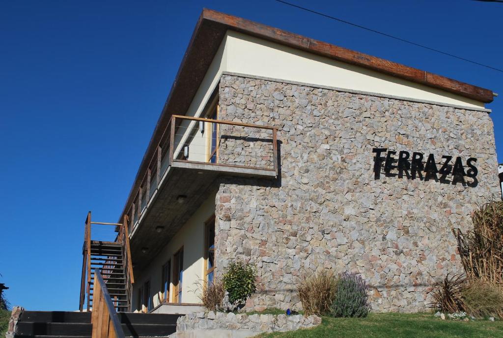 a building with thefamousfamous sign on the side of it at Terrazas de Aguas Dulces in Aguas Dulces