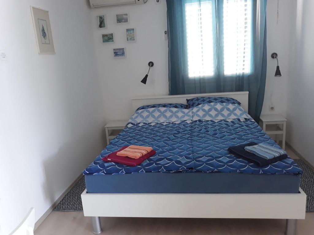 Posteľ alebo postele v izbe v ubytovaní Apartmani Balažić