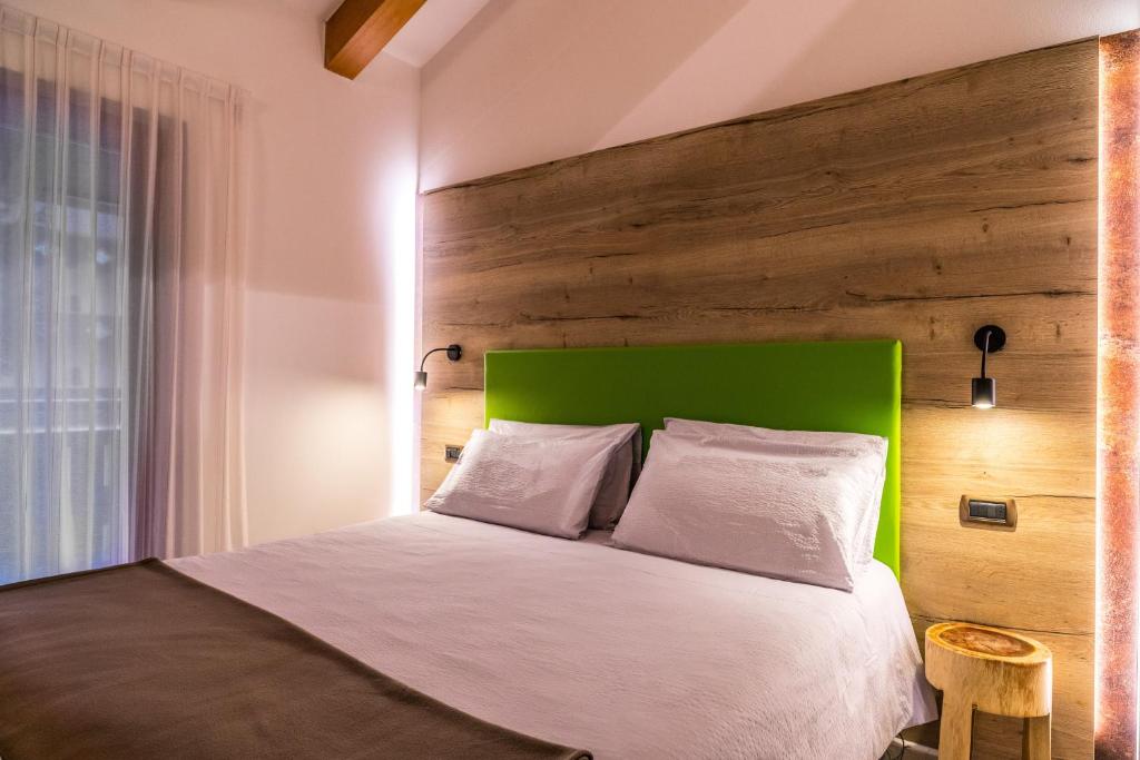 Postel nebo postele na pokoji v ubytování Hotel Folgarida