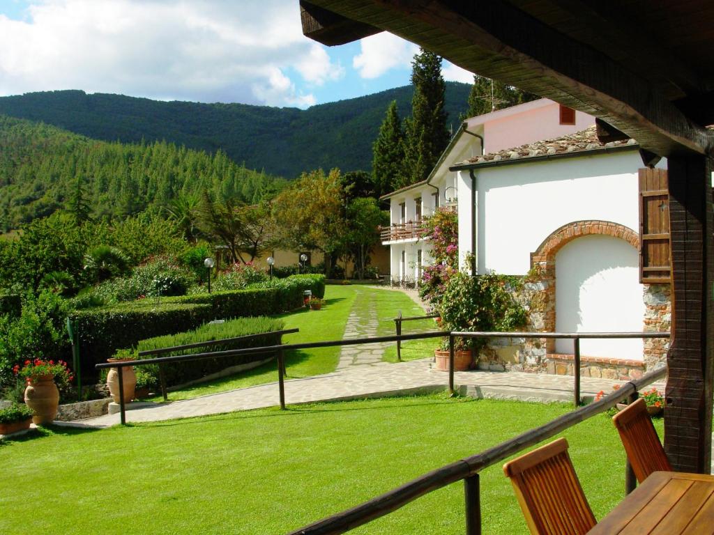 a view of a garden from a house at Hotel Il Caminetto in Portoferraio