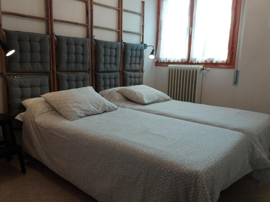 Postel nebo postele na pokoji v ubytování Best Biescas Tourist Home