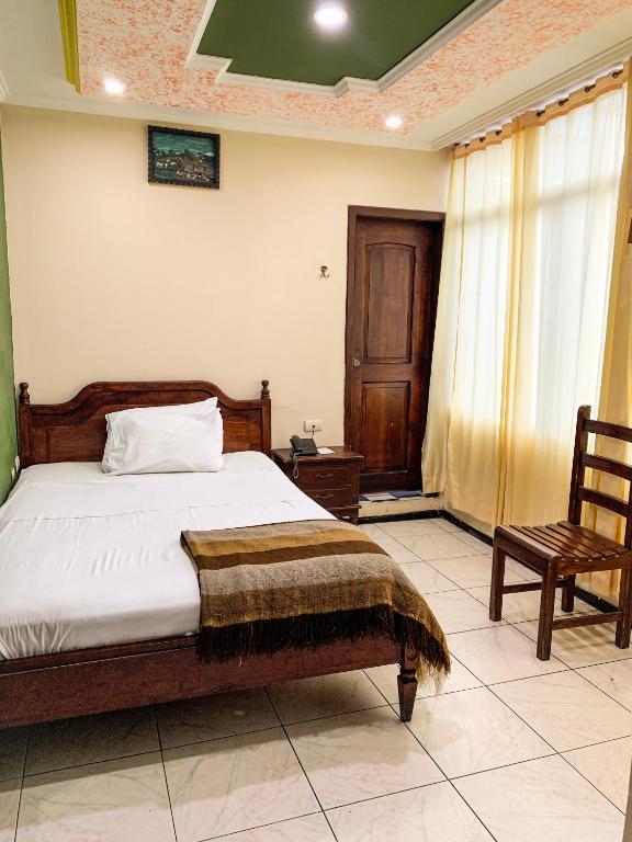 Postel nebo postele na pokoji v ubytování Hotel Somagg