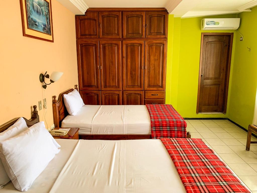 Postel nebo postele na pokoji v ubytování Hotel Somagg
