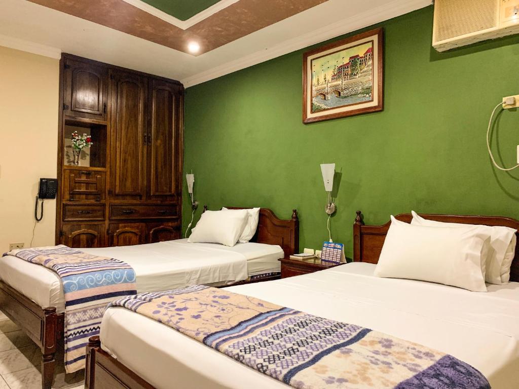 Postel nebo postele na pokoji v ubytování Hotel Somagg