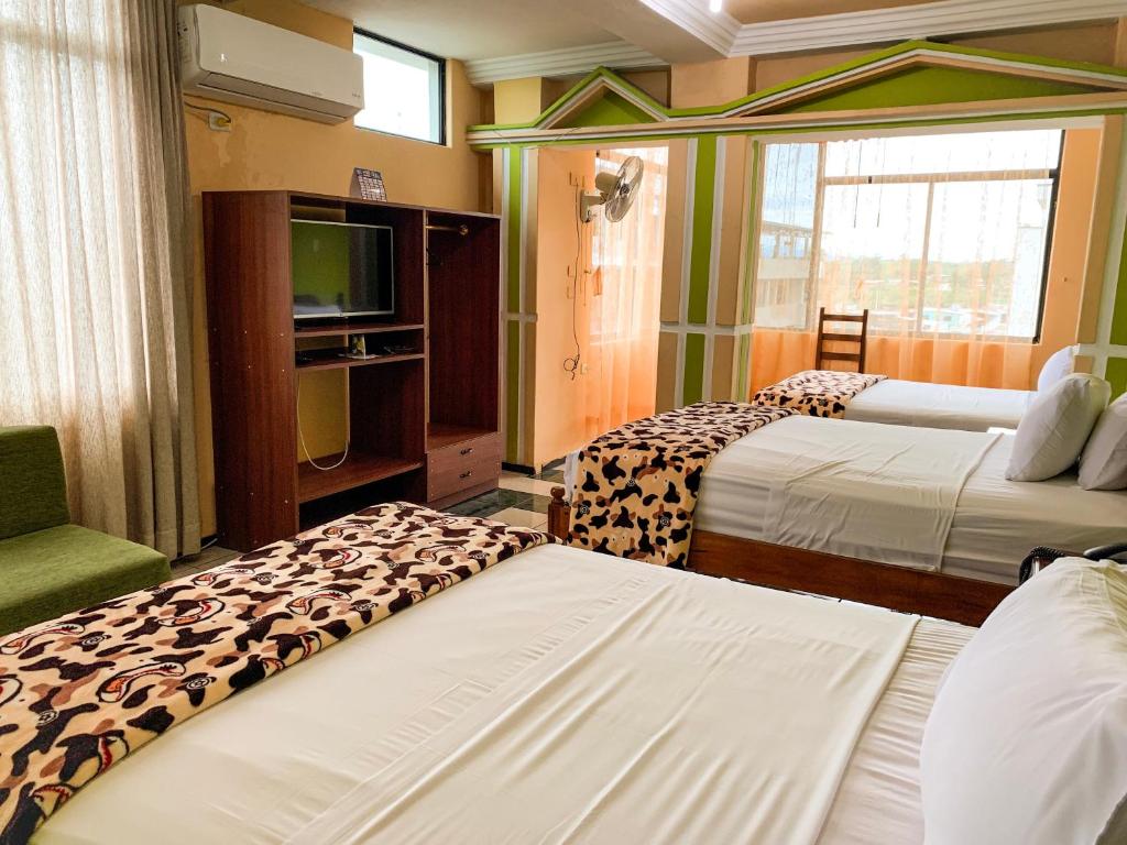 Postel nebo postele na pokoji v ubytování Hotel Somagg