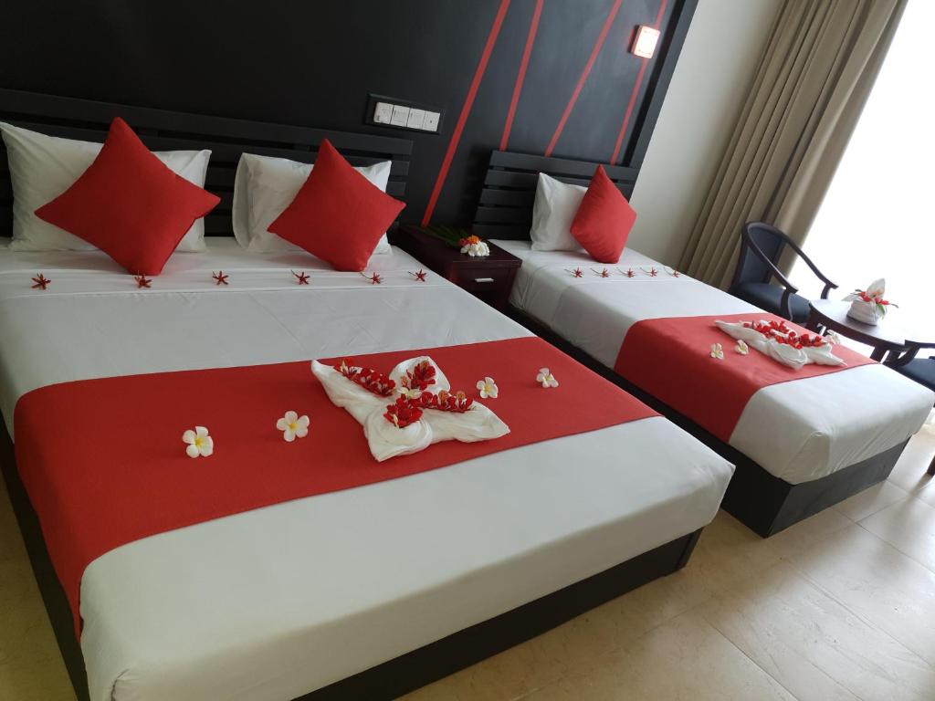 Postel nebo postele na pokoji v ubytování Nasau Resort & Villas