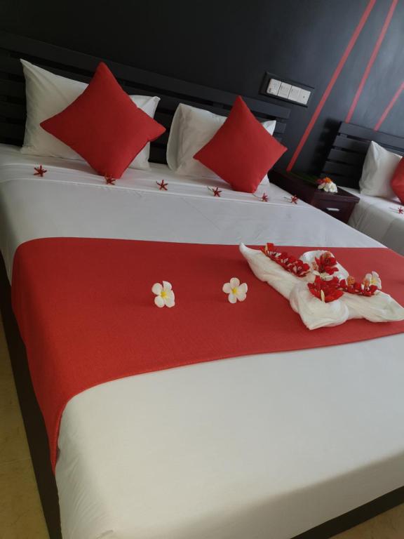 Postel nebo postele na pokoji v ubytování Nasau Resort & Villas
