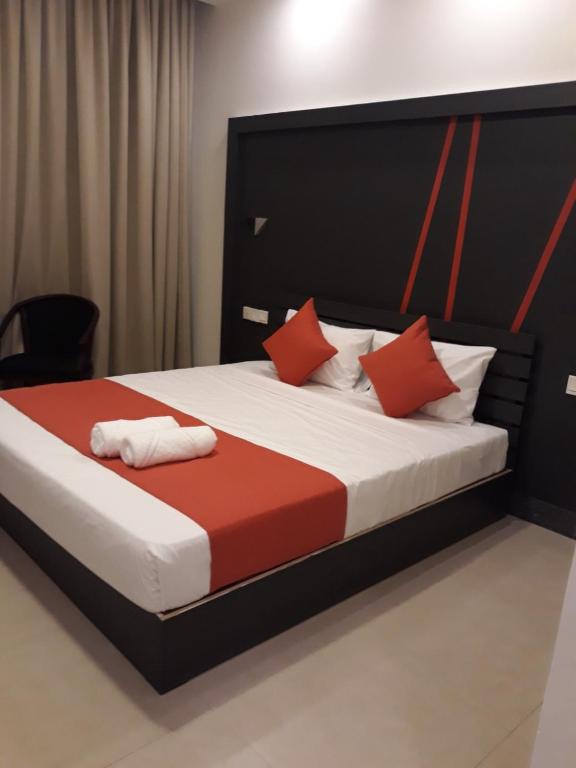 Postel nebo postele na pokoji v ubytování Nasau Resort & Villas
