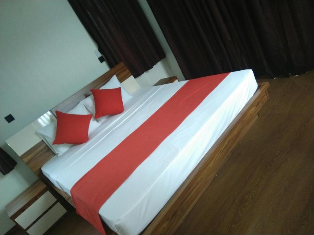Postel nebo postele na pokoji v ubytování Nasau Resort & Villas
