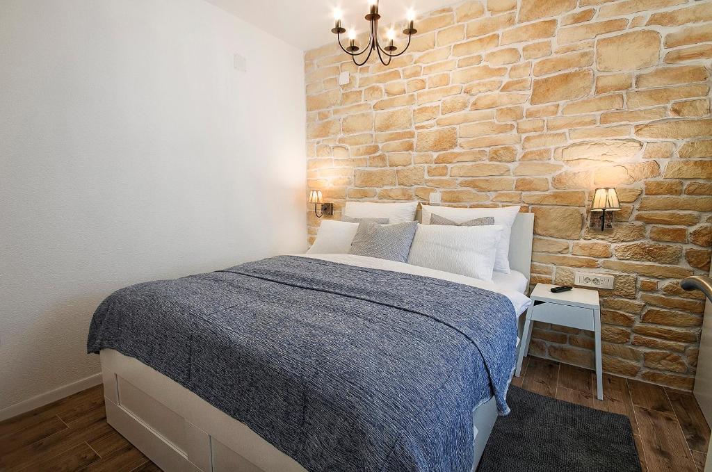 Postel nebo postele na pokoji v ubytování L&L Leisure Apartments Plitvice