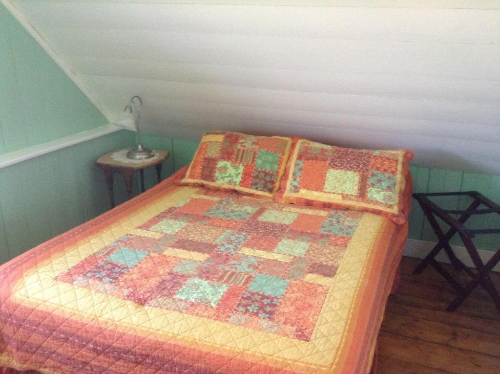 Postel nebo postele na pokoji v ubytování Gîte Au Coin De La Berge