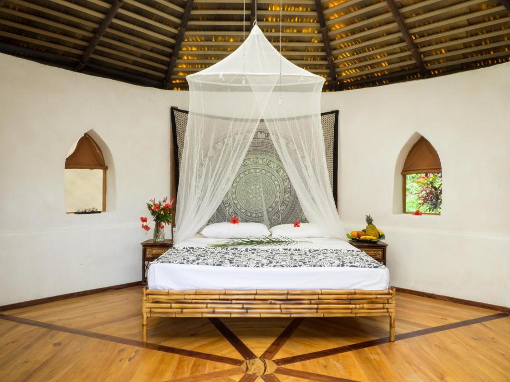 Postel nebo postele na pokoji v ubytování Paradiselodge Casa Romantica