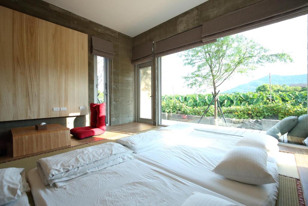 Postel nebo postele na pokoji v ubytování Chuying Sunrise B&B