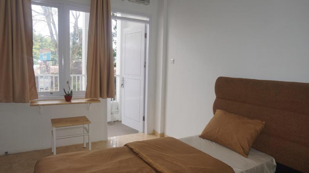 Postel nebo postele na pokoji v ubytování Al Barra Syariah Hotel