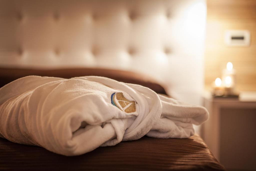 Postel nebo postele na pokoji v ubytování Piccolo Hotel Aurora