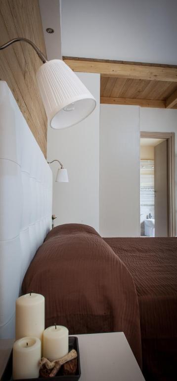 Postel nebo postele na pokoji v ubytování Piccolo Hotel Aurora