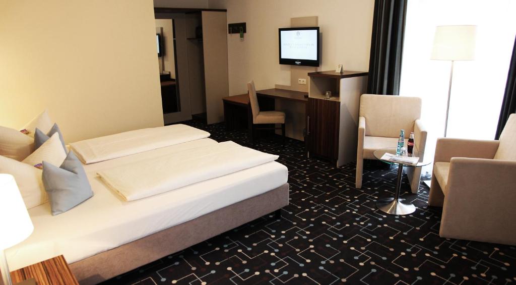 Postel nebo postele na pokoji v ubytování Hotel Königer