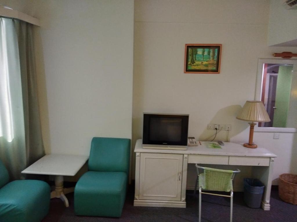 TV a/nebo společenská místnost v ubytování King Park Hotel Tawau