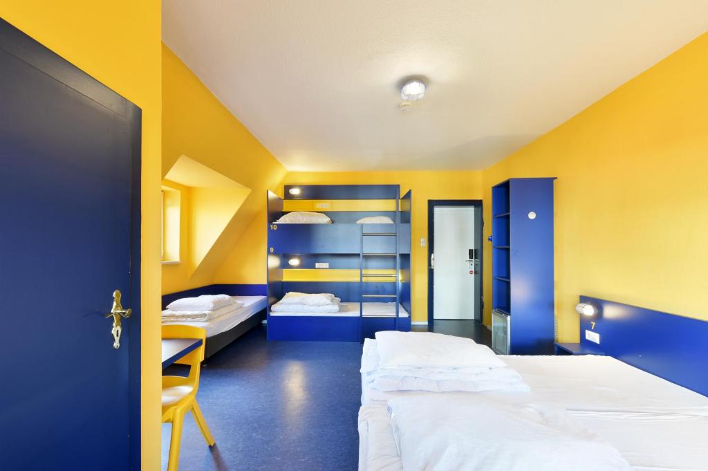 Postel nebo postele na pokoji v ubytování Bed’nBudget Expo-Hostel Dorms
