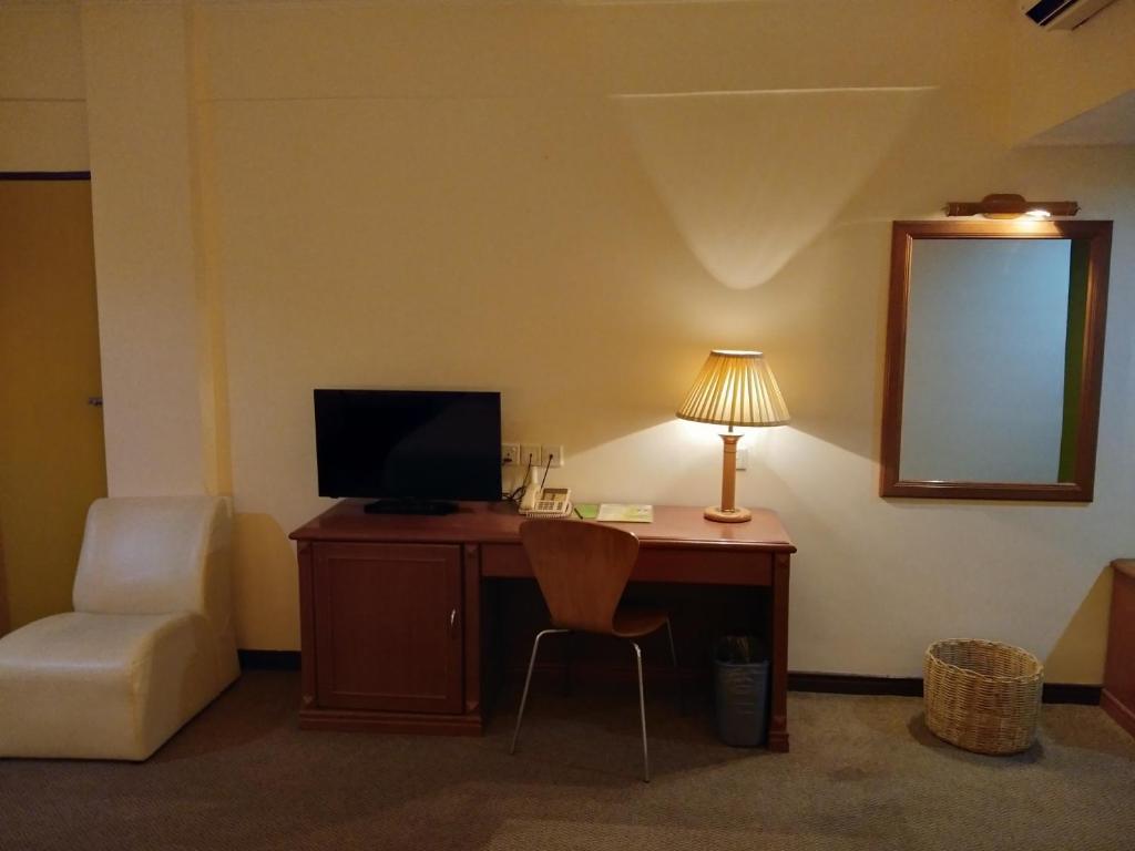 TV a/nebo společenská místnost v ubytování King Park Hotel Tawau