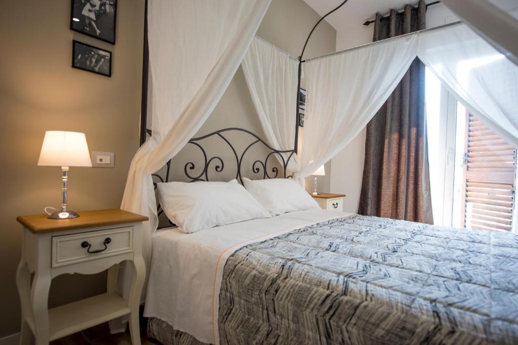Posteľ alebo postele v izbe v ubytovaní Il Parco dei Poeti B&B