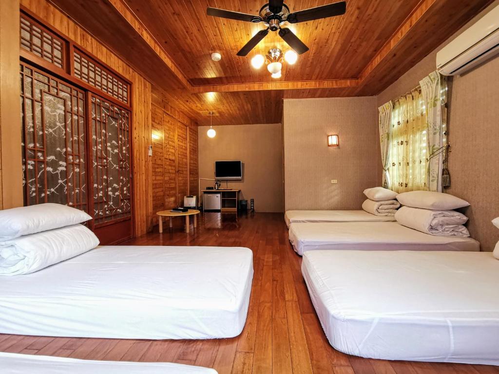 Postel nebo postele na pokoji v ubytování Sitou Peach Villa B&B