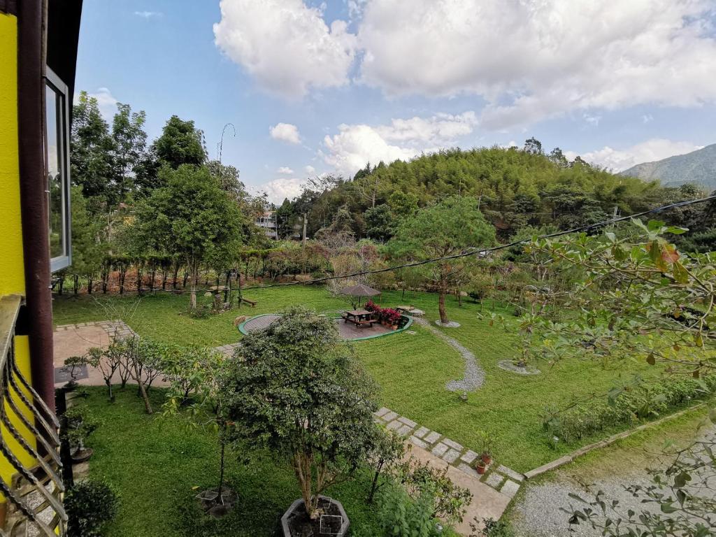 an aerial view of a garden with trees at Sitou Peach Villa B&amp;B in Lugu Lake