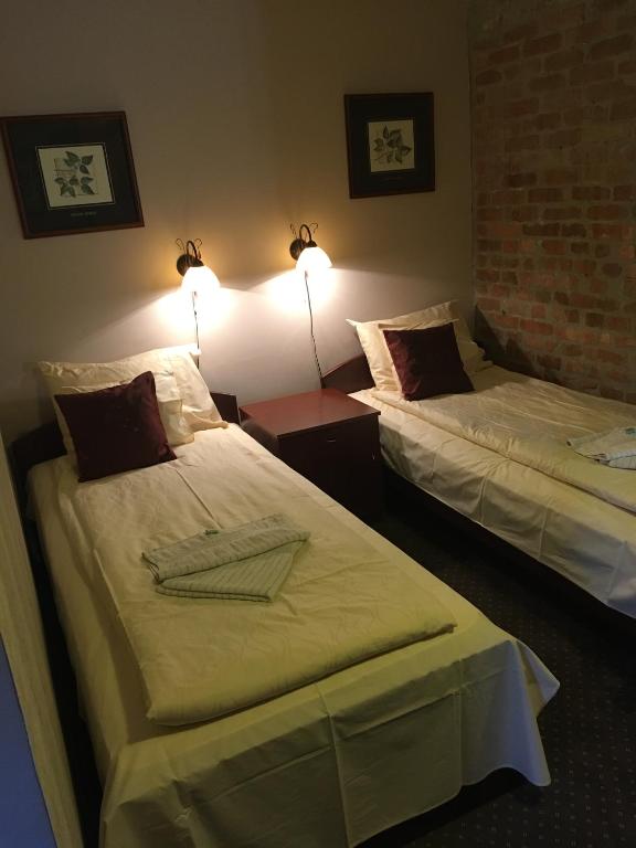 Rúm í herbergi á Guest House Prenoćište Piccolina