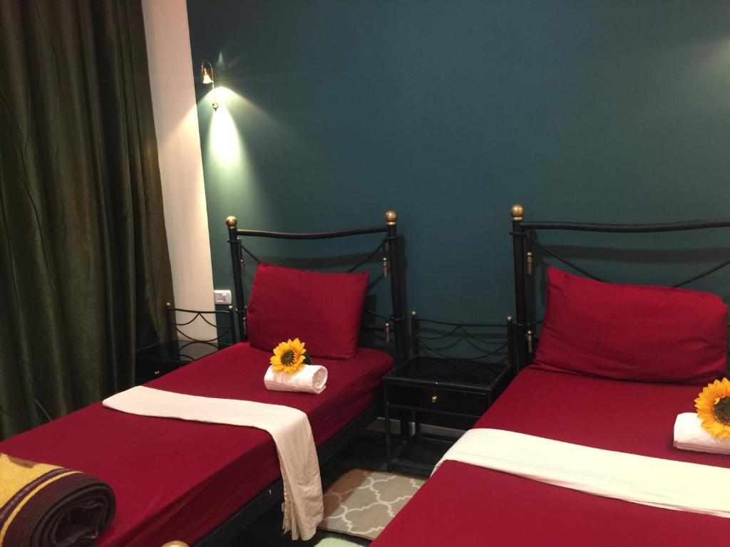 Postel nebo postele na pokoji v ubytování Nobel Hotel